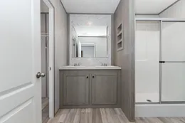 The BLAZER 66 F Primary Bedroom. This Manufactured Mobile Home features 3 bedrooms and 2 baths.