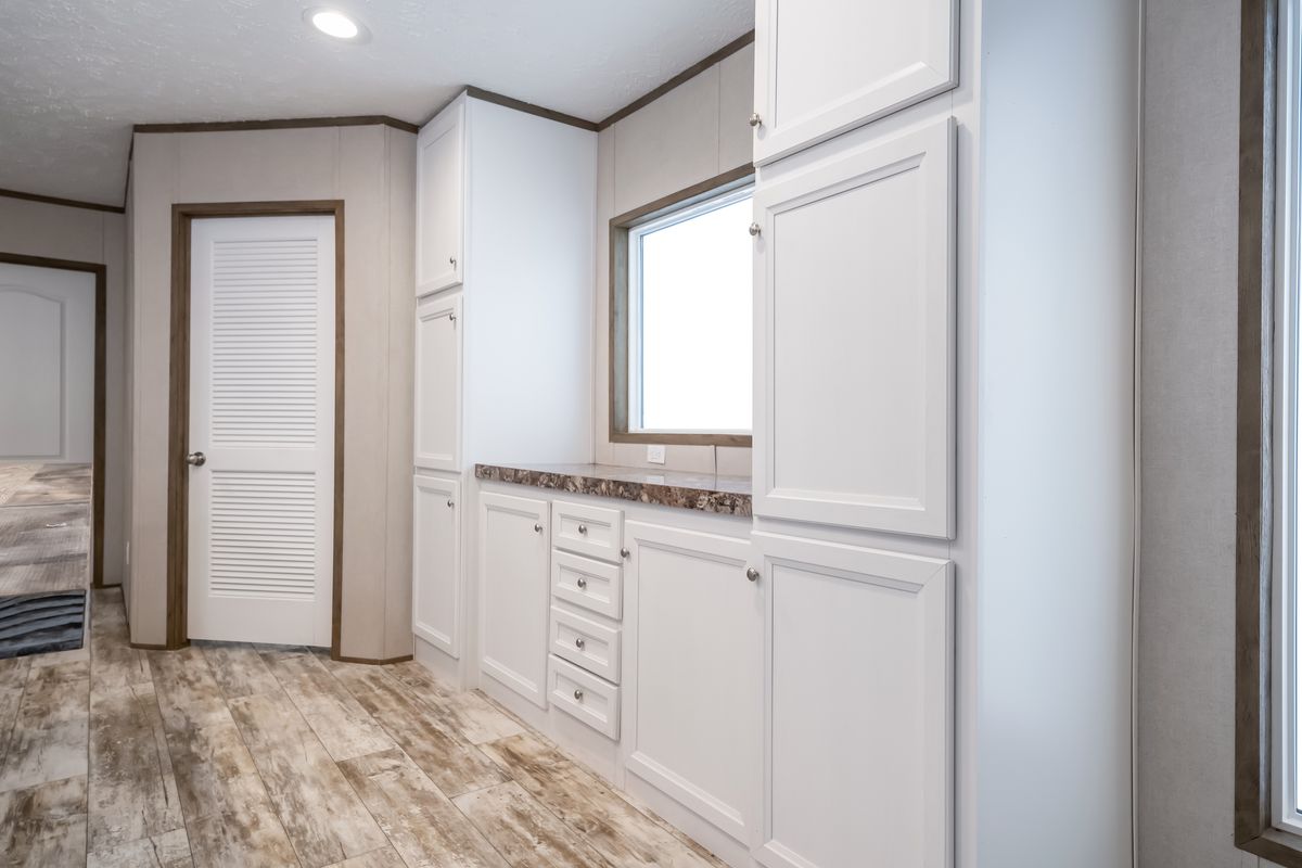 The ANNIVERSARY SPLASH Kitchen. This Manufactured Mobile Home features 3 bedrooms and 2 baths.