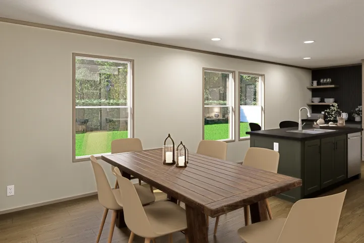 The RAINIER Dining Area. This Manufactured Mobile Home features 4 bedrooms and 3 baths.