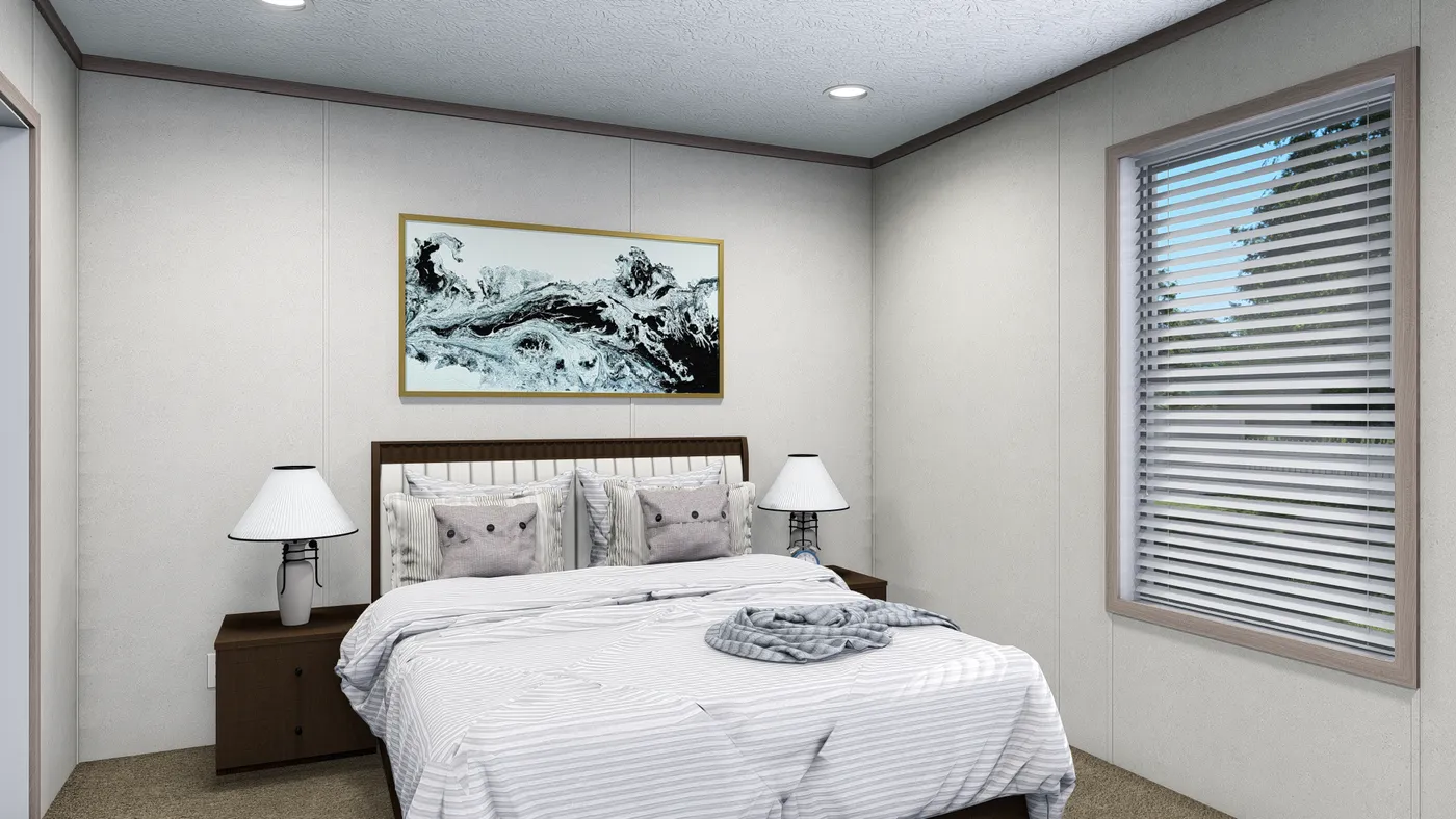 The 5624-E744 THE PULSE Primary Bedroom. This Manufactured Mobile Home features 3 bedrooms and 2 baths.