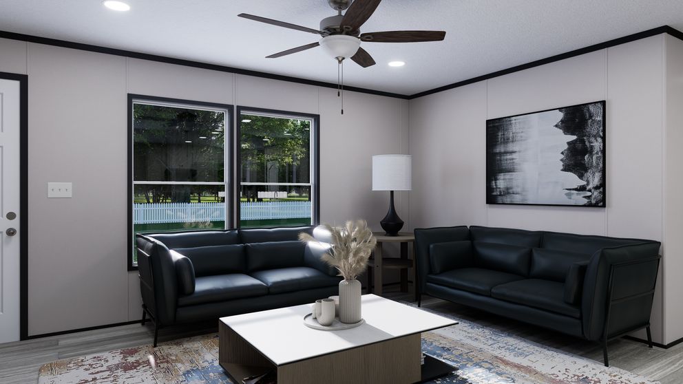 The THE MOUNTAINEER 56 Living Room. This Manufactured Mobile Home features 3 bedrooms and 2 baths.