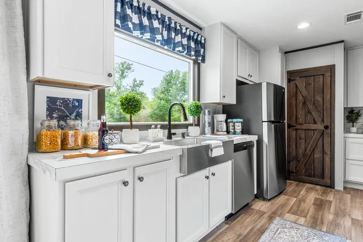 The THE ANNIVERSARY 2.1 Kitchen. This Manufactured Mobile Home features 3 bedrooms and 2 baths.