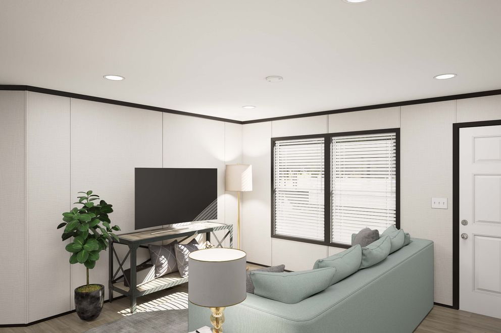 The PLATINUM ANNIVERSARY Living Room. This Manufactured Mobile Home features 3 bedrooms and 2 baths.