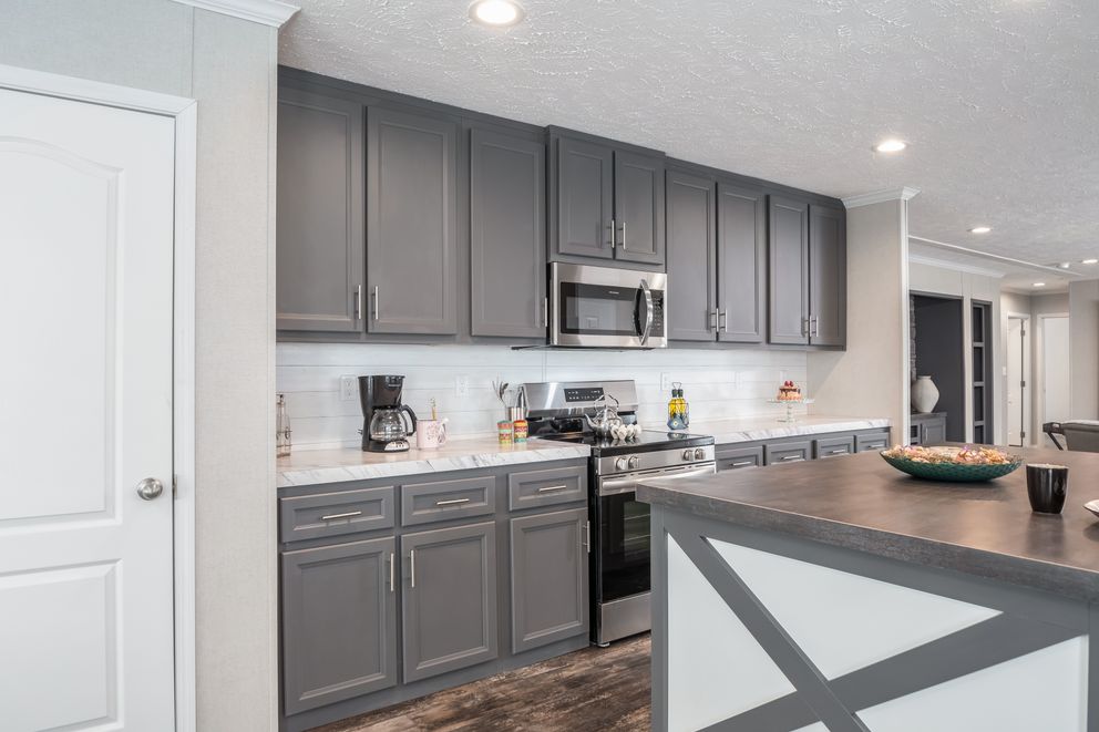 The ALL AMERICAN Kitchen. This Manufactured Mobile Home features 3 bedrooms and 2 baths.