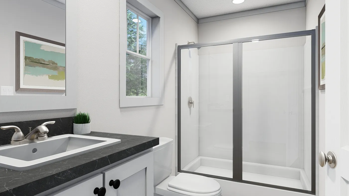 The BORN TO RUN Primary Bathroom. This Manufactured Mobile Home features 2 bedrooms and 2 baths.