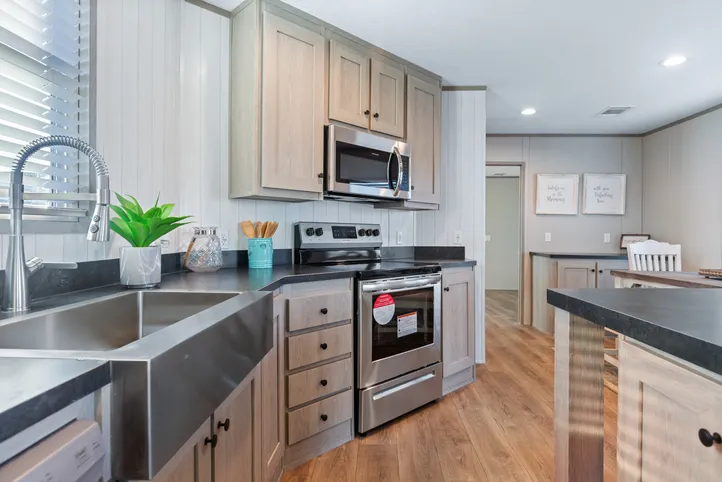 The RESOLUTION 16763J Kitchen. This Manufactured Mobile Home features 3 bedrooms and 2 baths.