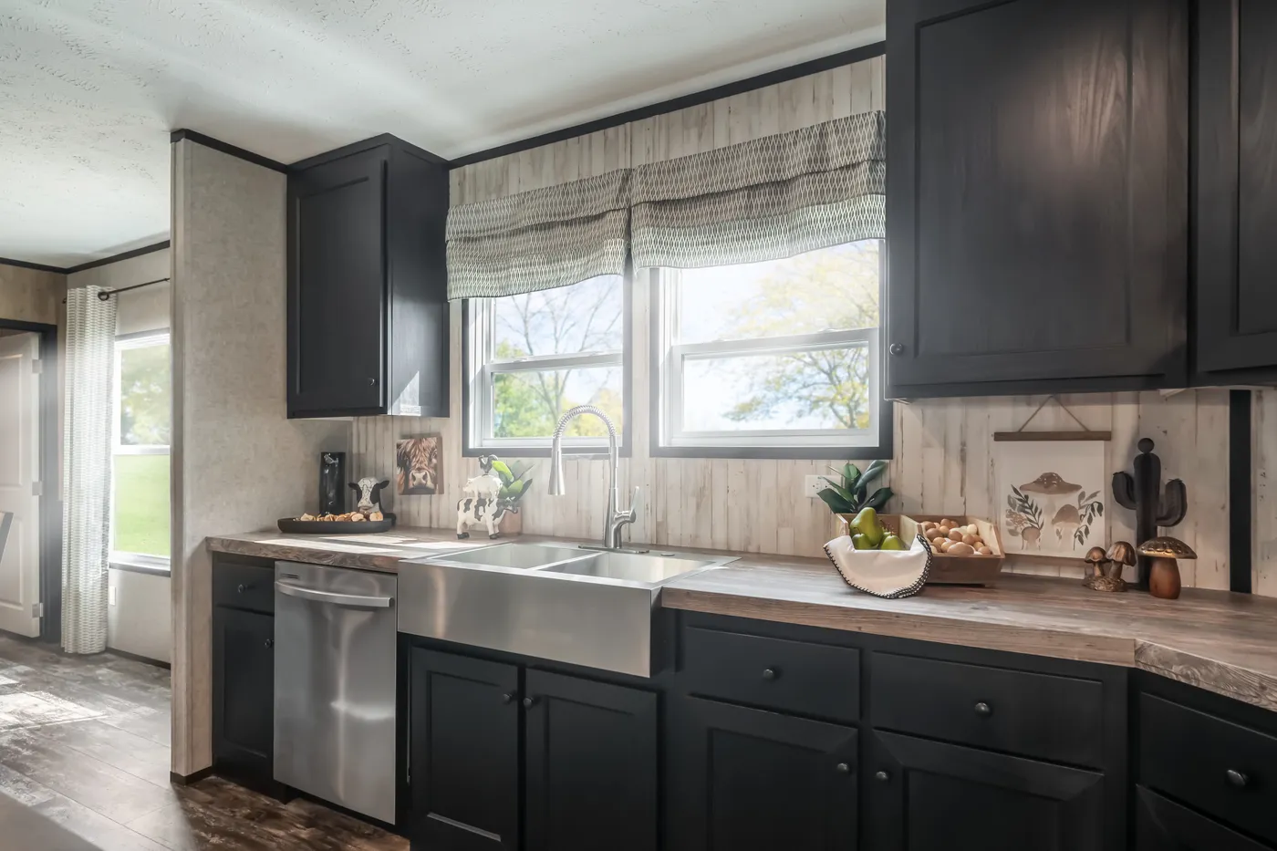 The THE TRIBUTARY Kitchen. This Manufactured Mobile Home features 3 bedrooms and 2 baths.