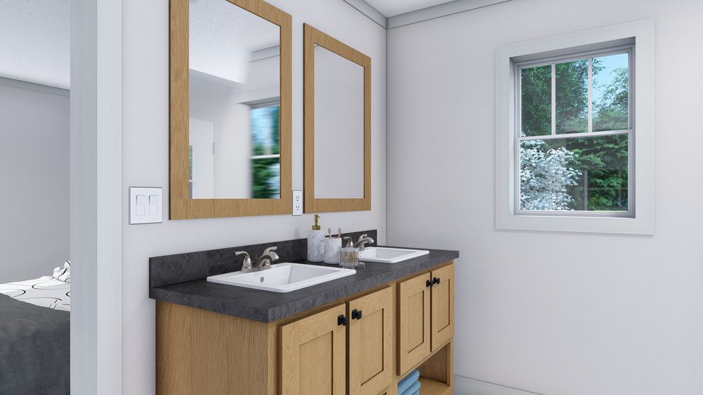 The SHOUT Primary Bathroom. This Manufactured Mobile Home features 3 bedrooms and 2 baths.