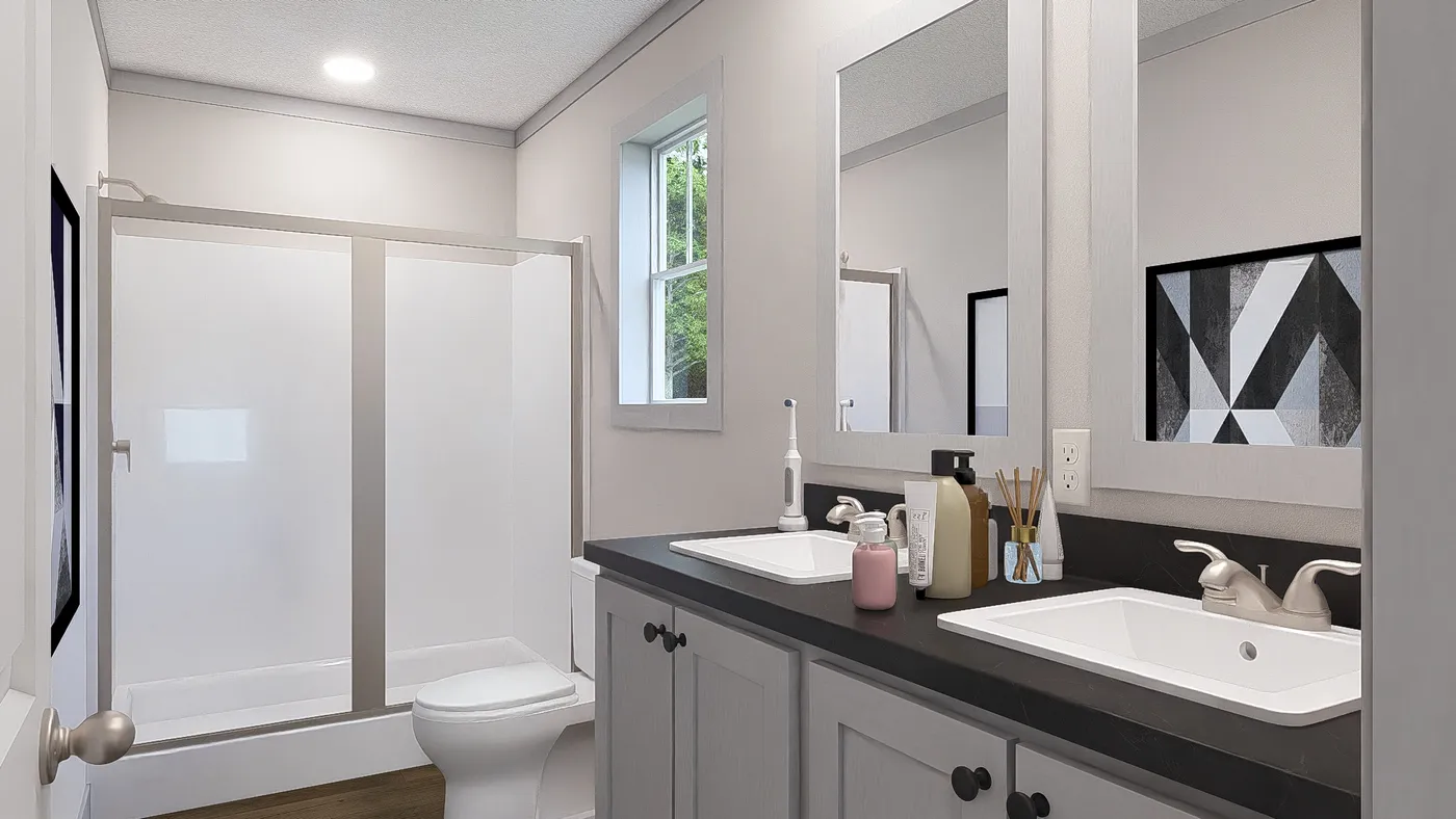The JOHNNY B GOODE Primary Bathroom. This Manufactured Mobile Home features 3 bedrooms and 2 baths.
