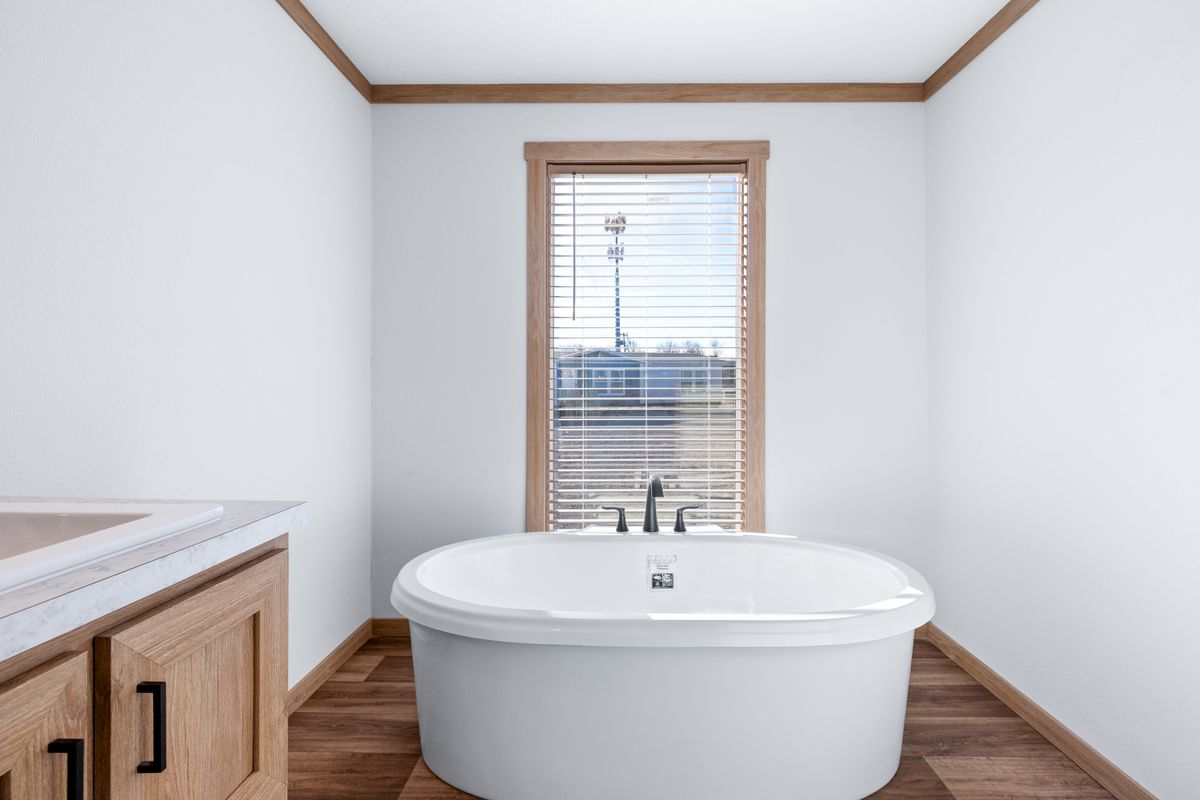 The TINSLEY Primary Bathroom. This Manufactured Mobile Home features 4 bedrooms and 2 baths.