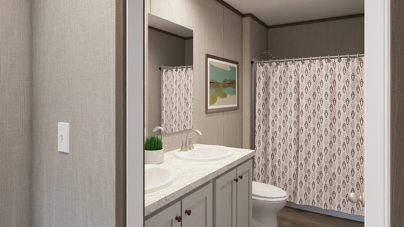 The LEGEND BIG BOY Guest Bathroom. This Manufactured Mobile Home features 4 bedrooms and 2 baths.