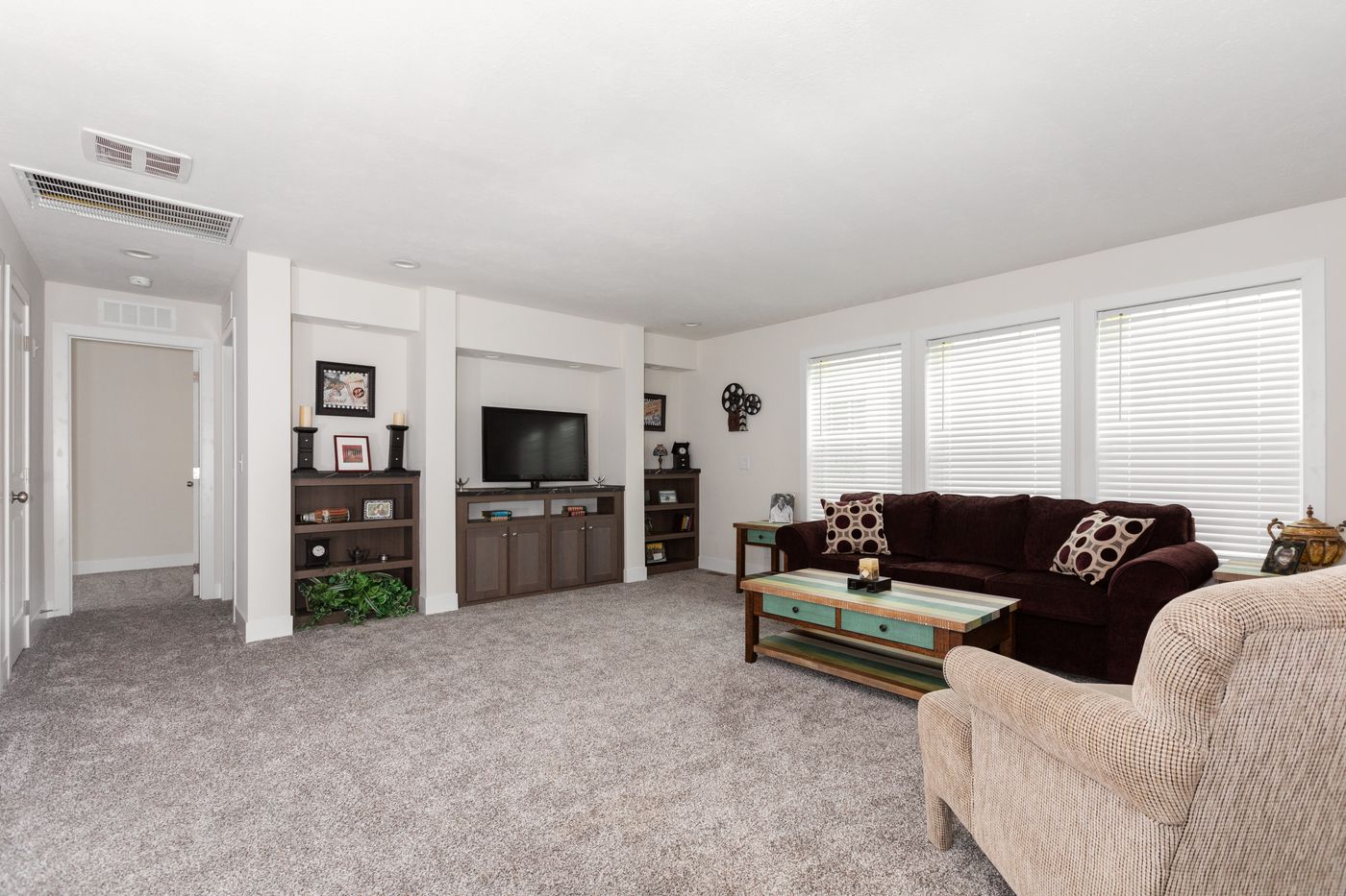The HILL ST/5628-MS020-1 SECT Living Room. This Manufactured Mobile Home features 3 bedrooms and 2 baths.