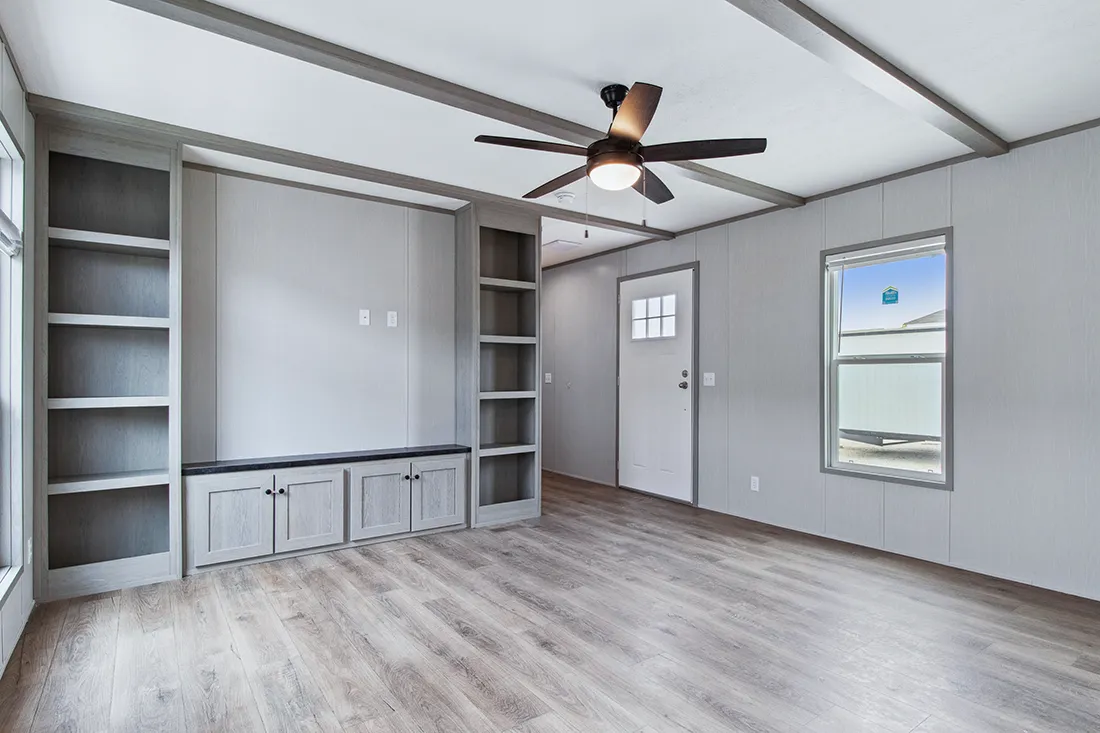 The ANNIVERSARY 16682F Living Room. This Manufactured Mobile Home features 2 bedrooms and 2 baths.