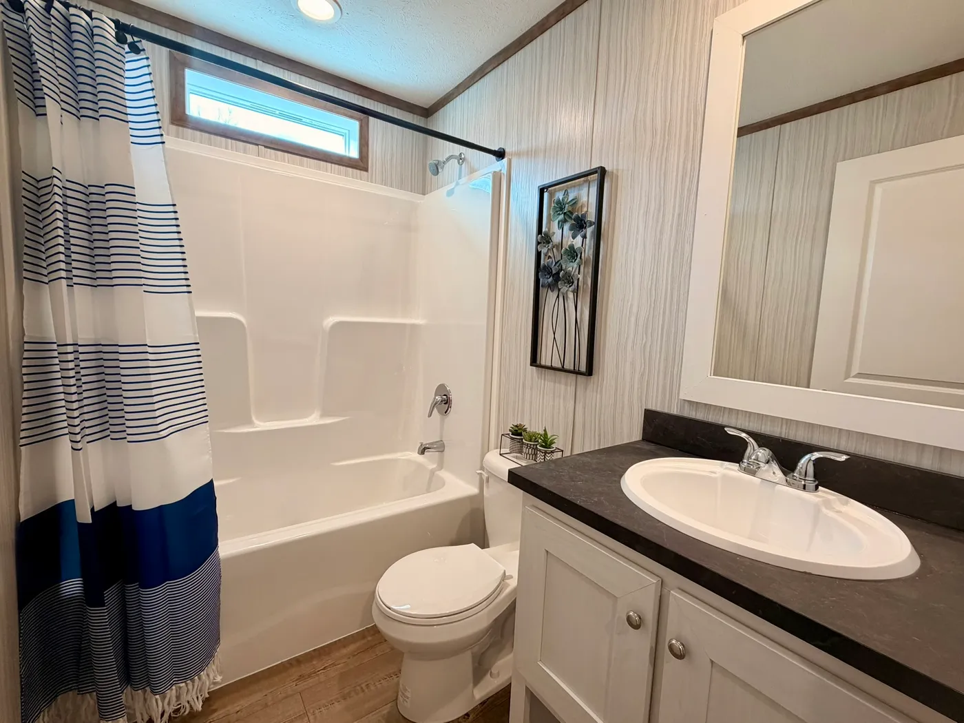 The APATITE Guest Bathroom. This Manufactured Mobile Home features 3 bedrooms and 2 baths.