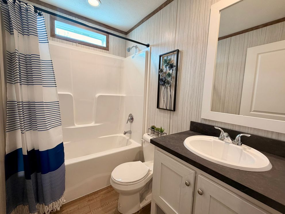 The APATITE Guest Bathroom. This Manufactured Mobile Home features 3 bedrooms and 2 baths.