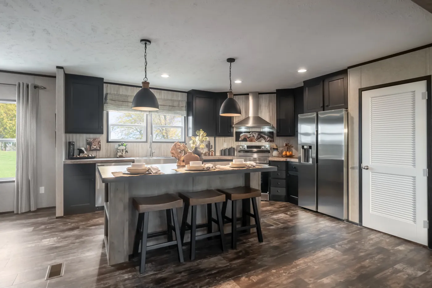 The THE TRIBUTARY Kitchen. This Manufactured Mobile Home features 3 bedrooms and 2 baths.