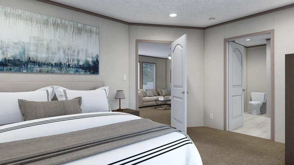 The 5624-E734P THE PULSE Primary Bedroom. This Manufactured Mobile Home features 3 bedrooms and 2 baths.