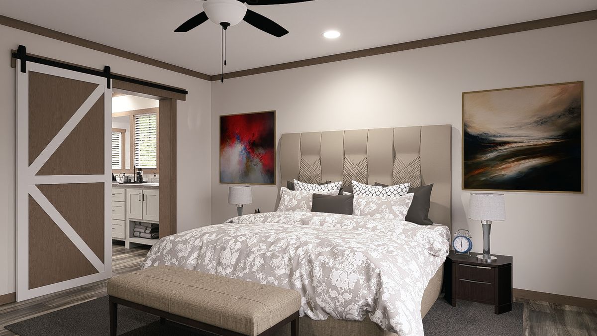 The SAWYER ELITE Primary Bedroom. This Manufactured Mobile Home features 3 bedrooms and 2 baths.