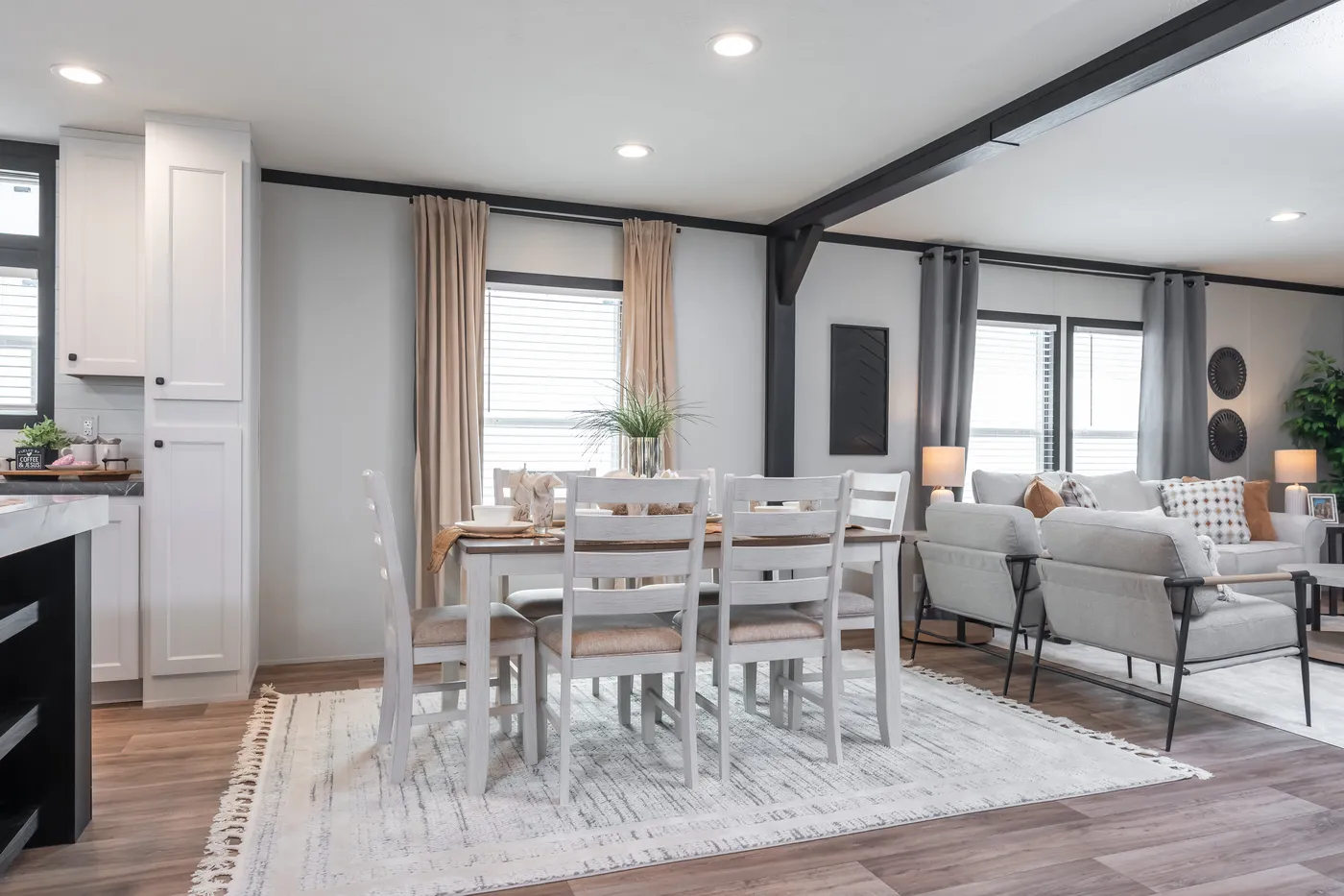 The ABSOLUTE VALUE Dining Area. This Manufactured Mobile Home features 4 bedrooms and 2 baths.