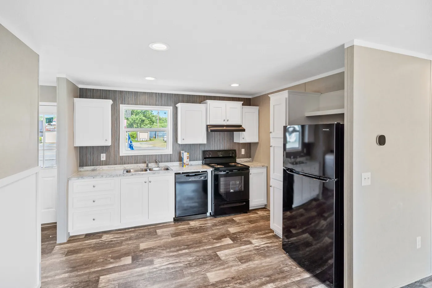 The ZIRCON Kitchen. This Manufactured Mobile Home features 3 bedrooms and 2 baths.