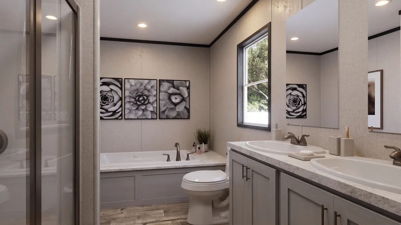 The THE MOUNTAINEER 52 Primary Bathroom. This Manufactured Mobile Home features 3 bedrooms and 2 baths.