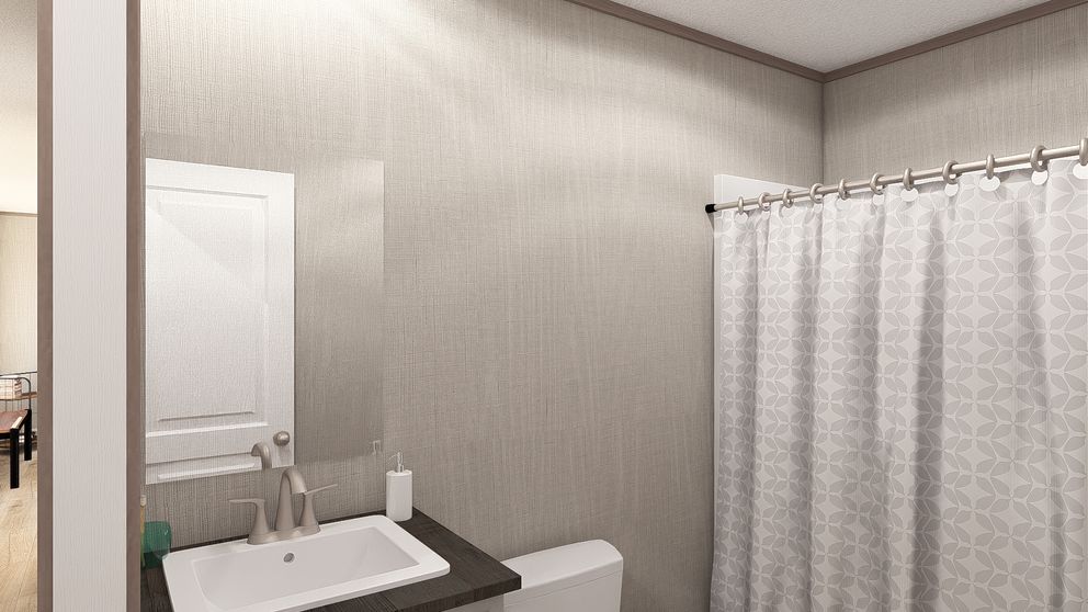 The ULTRA A-PLUS 16X76 Guest Bathroom. This Manufactured Mobile Home features 3 bedrooms and 2 baths.