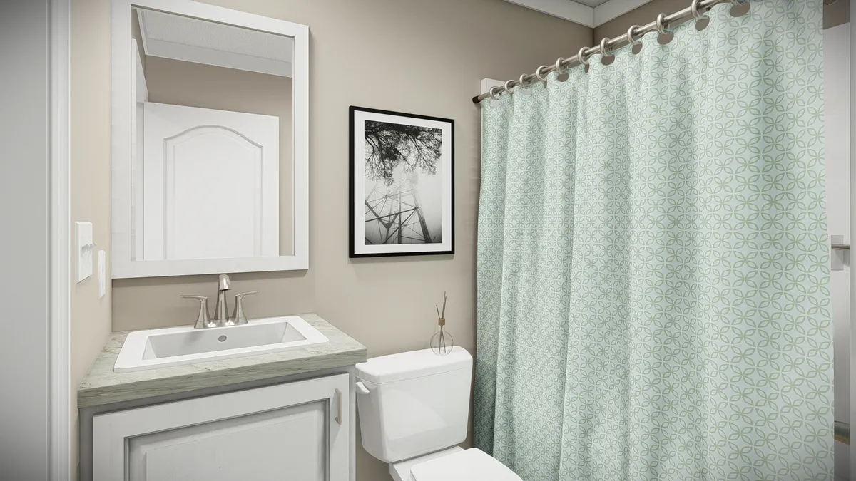 The THE DREAM Guest Bathroom. This Manufactured Mobile Home features 3 bedrooms and 2 baths.