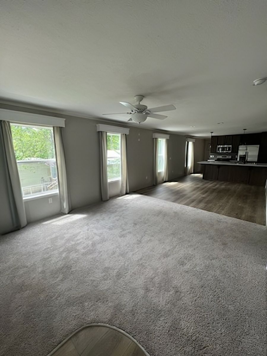 The JADE 48 Living Room. This Manufactured Mobile Home features 3 bedrooms and 2 baths.