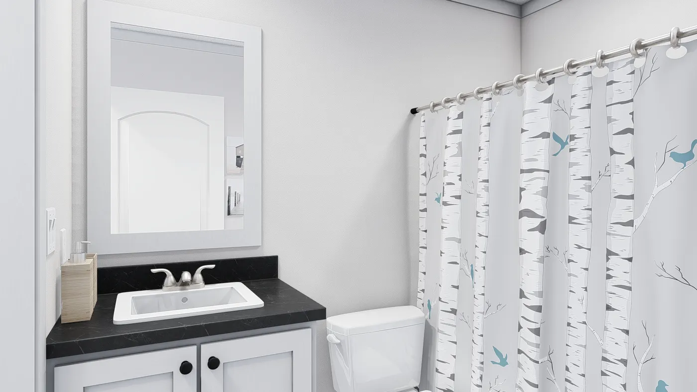 The STILL THE ONE Guest Bathroom. This Manufactured Mobile Home features 2 bedrooms and 2 baths.