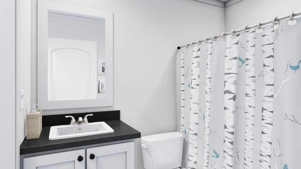 The STILL THE ONE Guest Bathroom. This Manufactured Mobile Home features 2 bedrooms and 2 baths.