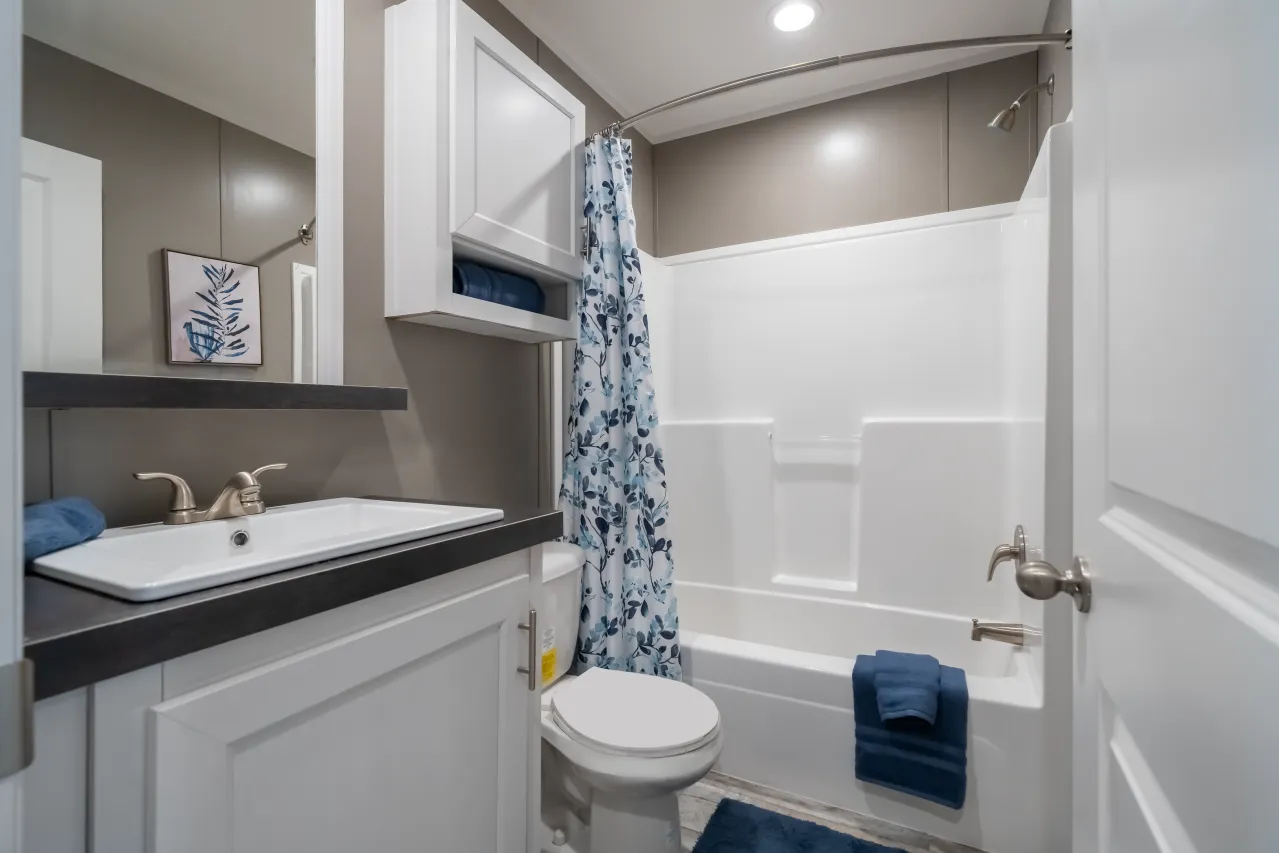 The LIBERTY Guest Bathroom. This Manufactured Mobile Home features 3 bedrooms and 2 baths.