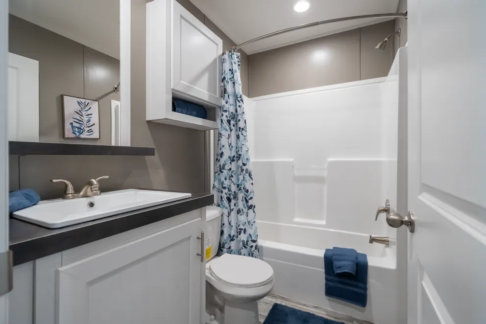 The LIBERTY Guest Bathroom. This Manufactured Mobile Home features 3 bedrooms and 2 baths.