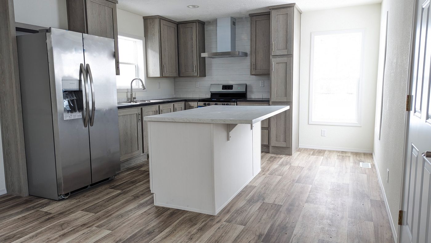The RAMSEY 210-1 Kitchen. This Manufactured Mobile Home features 2 bedrooms and 1 bath.