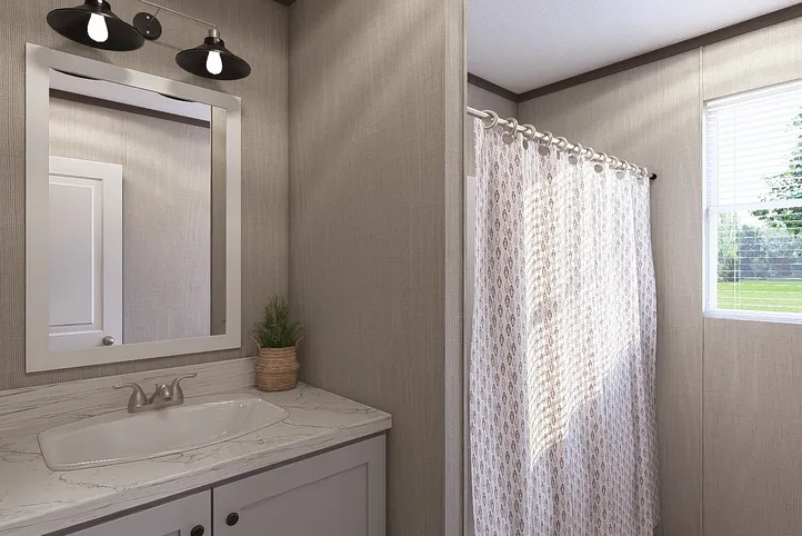 The THE RESERVE 60 Guest Bathroom. This Manufactured Mobile Home features 3 bedrooms and 2 baths.
