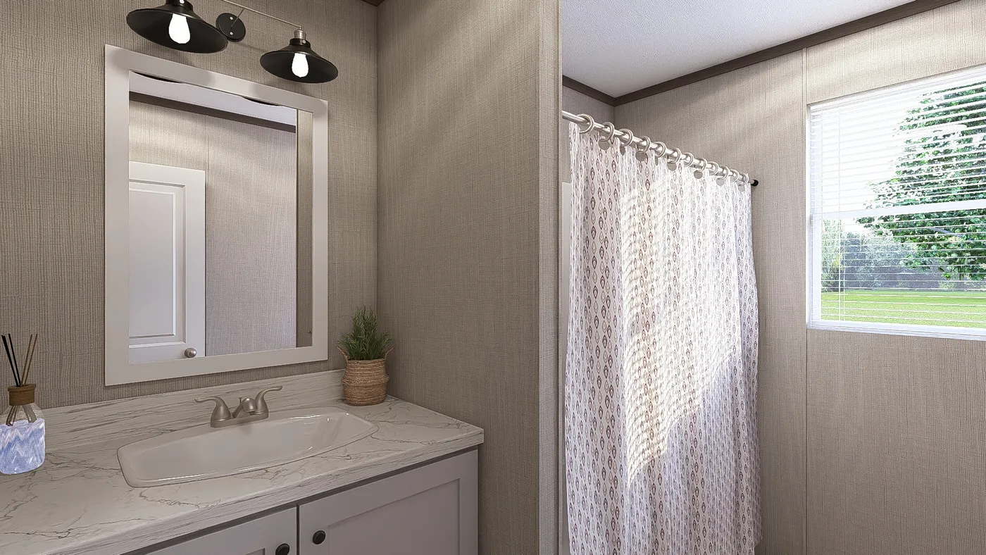 The THE RESERVE 60 Guest Bathroom. This Manufactured Mobile Home features 3 bedrooms and 2 baths.
