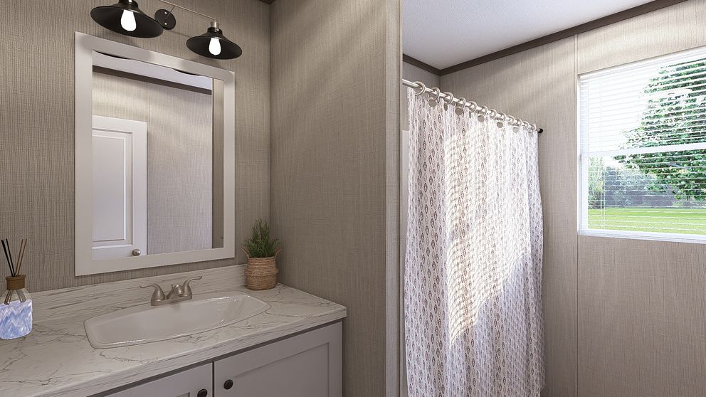 The THE RESERVE 60 Guest Bathroom. This Manufactured Mobile Home features 3 bedrooms and 2 baths.