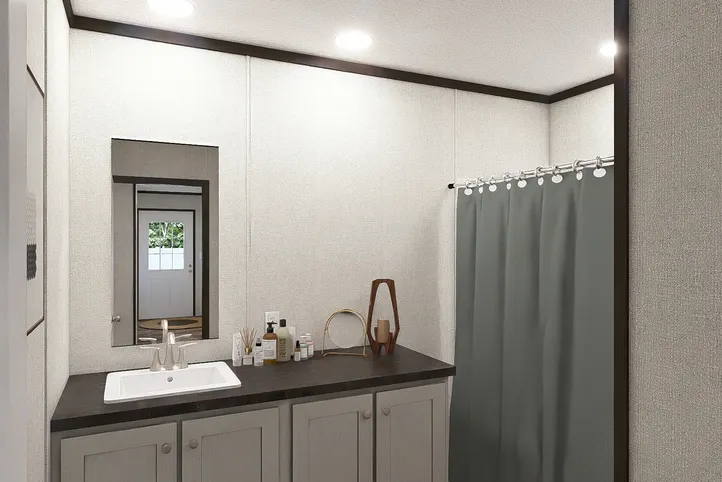 The OCCASION Guest Bathroom. This Manufactured Mobile Home features 4 bedrooms and 2 baths.