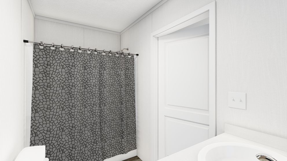 The PERIDOT 56 Primary Bathroom. This Manufactured Mobile Home features 2 bedrooms and 2 baths.