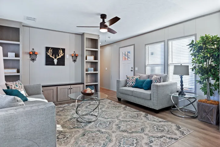 The RESOLUTION 16763J Living Room. This Manufactured Mobile Home features 3 bedrooms and 2 baths.