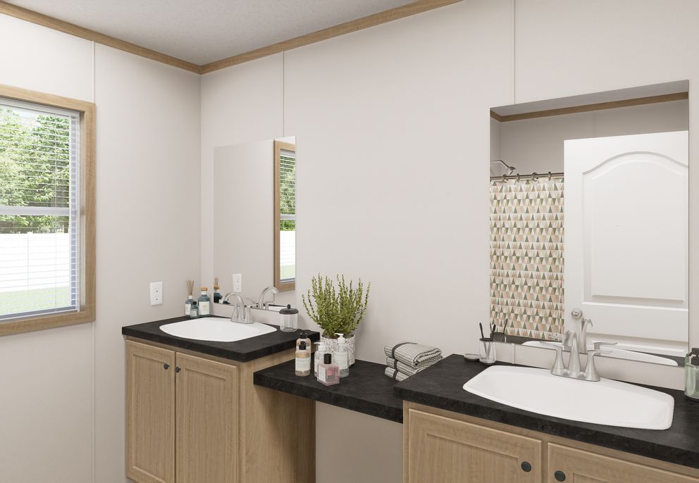The THE MOUNTAINEER 72 Guest Bathroom. This Manufactured Mobile Home features 3 bedrooms and 2 baths.