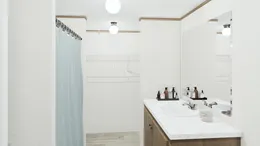 The SPECTACULAR Primary Bathroom. This Manufactured Mobile Home features 3 bedrooms and 2 baths.