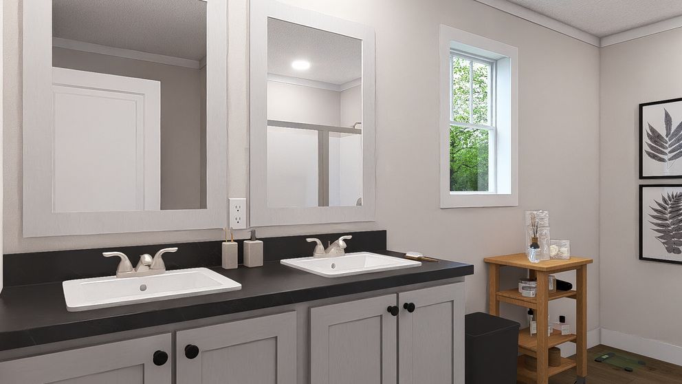 The HEY JUDE Primary Bathroom. This Manufactured Mobile Home features 4 bedrooms and 2 baths.