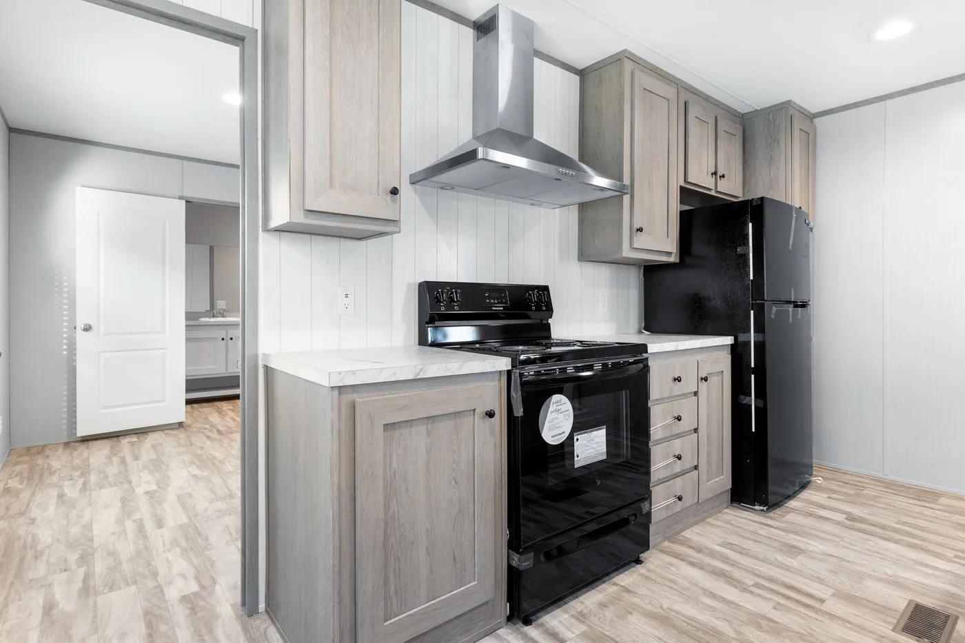 The BREEZE 16602A Kitchen. This Manufactured Mobile Home features 2 bedrooms and 2 baths.