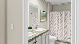 The ULTRA EXCEL BIG BOY 4 BR 32X76 Guest Bathroom. This Manufactured Mobile Home features 4 bedrooms and 2 baths.