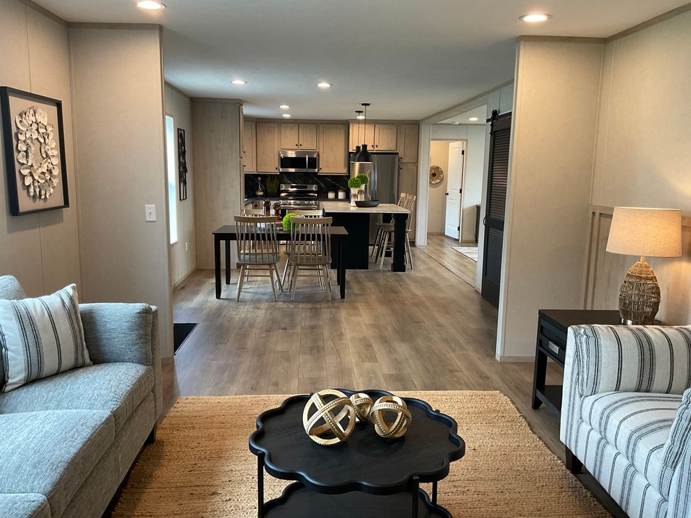 The EMERALD 7228-643 Living Room. This Manufactured Mobile Home features 4 bedrooms and 2 baths.