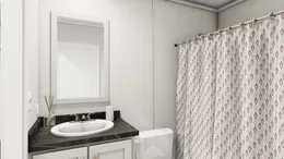 The TURQUOISE Guest Bathroom. This Manufactured Mobile Home features 2 bedrooms and 2 baths.