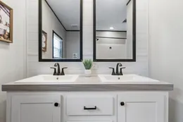 The HERCULES Guest Bathroom. This Manufactured Mobile Home features 4 bedrooms and 2 baths.