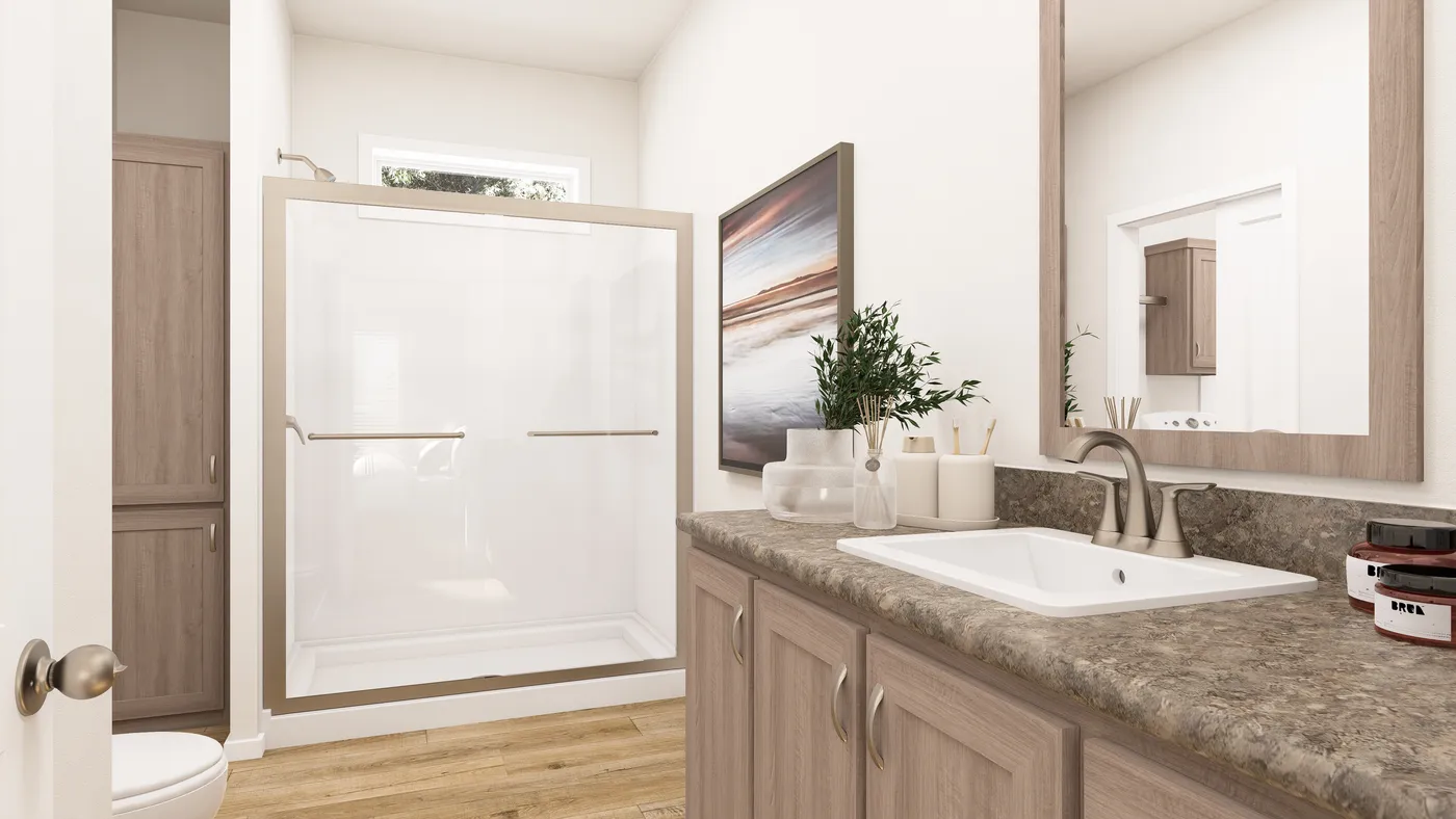 The PREFERRED PLUS CP561F  CLAYTON Primary Bathroom. This Manufactured Mobile Home features 3 bedrooms and 2 baths.