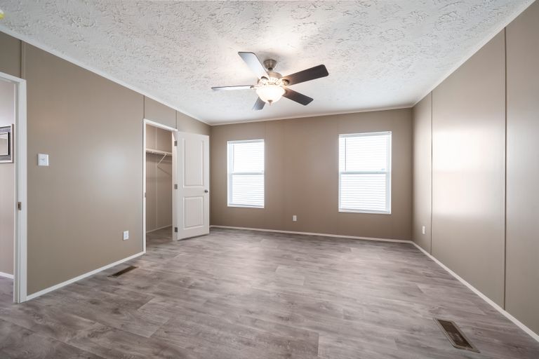 The ISLAND BREEZE Bedroom. This Manufactured Mobile Home features 3 bedrooms and 2 baths.