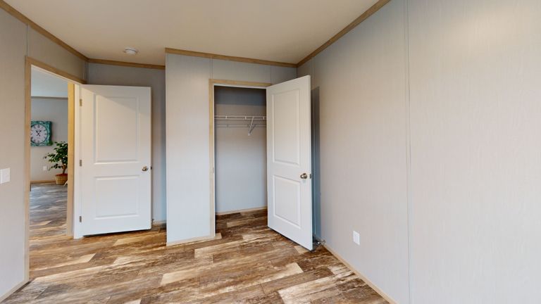 The HANCOCK Guest Bedroom. This Manufactured Mobile Home features 4 bedrooms and 2 baths.
